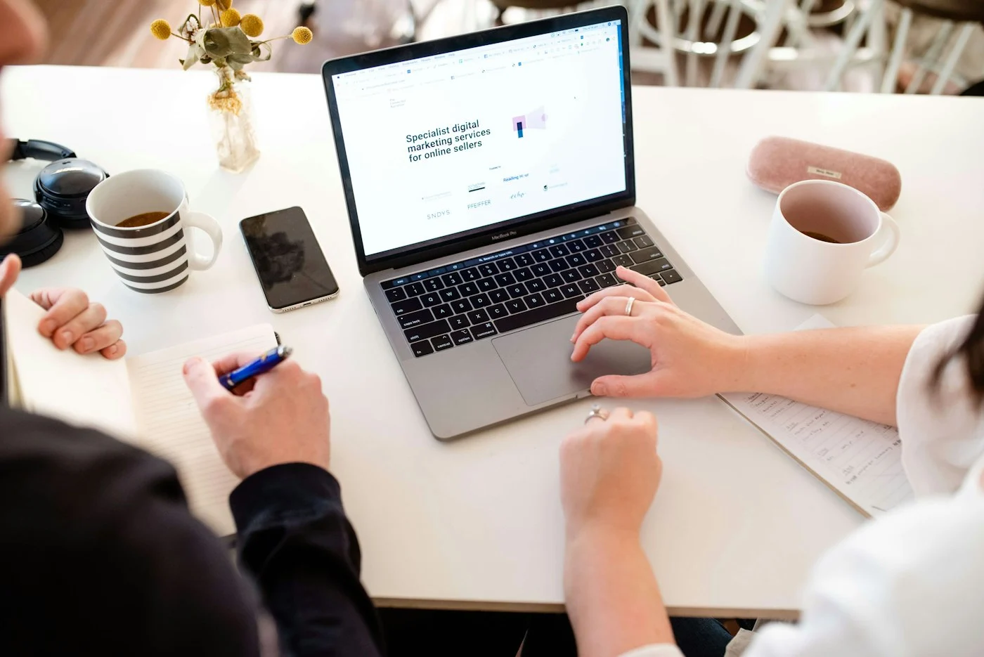 Small business professionals reviewing a website and marketing plan together